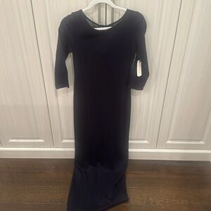 Brand new with tags attached. Black long dress with sleeves. See through back.